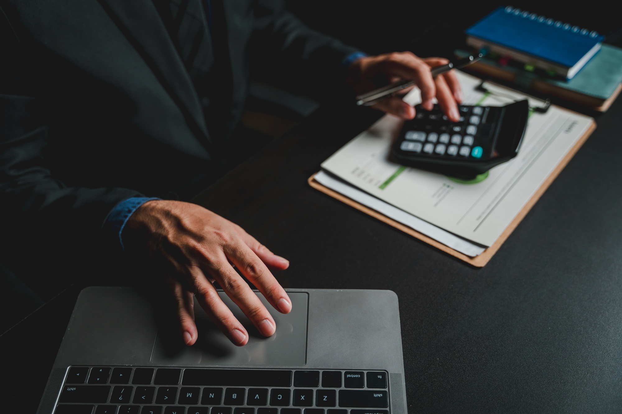 Portrait of man working on tablet computer in modern office make account analysis report Real estate